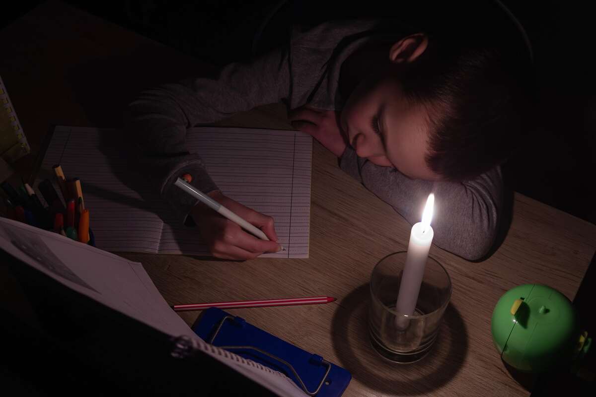 Sleeping-Boy-Under-Candle-Light