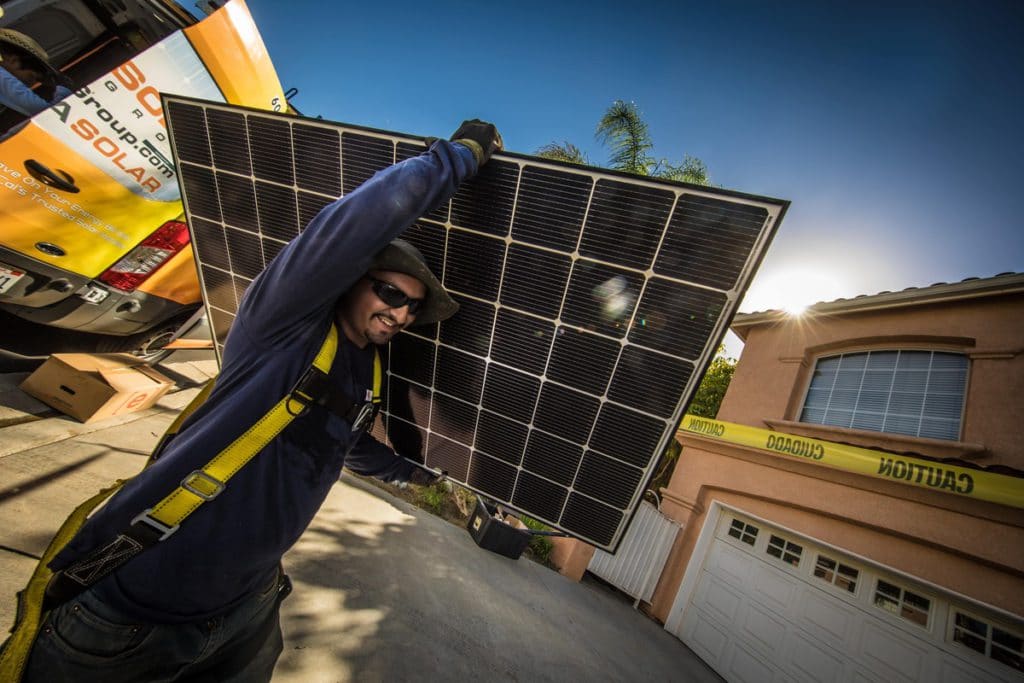 La-Solar-Group-Employee-Carrying-Solar-Panel
