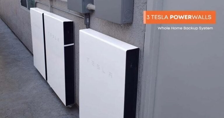 Three Tesla Powerwalls installed outdoors for home backup energy storage.