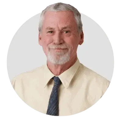 Senior man in professional attire, representing expertise in solar energy solutions.