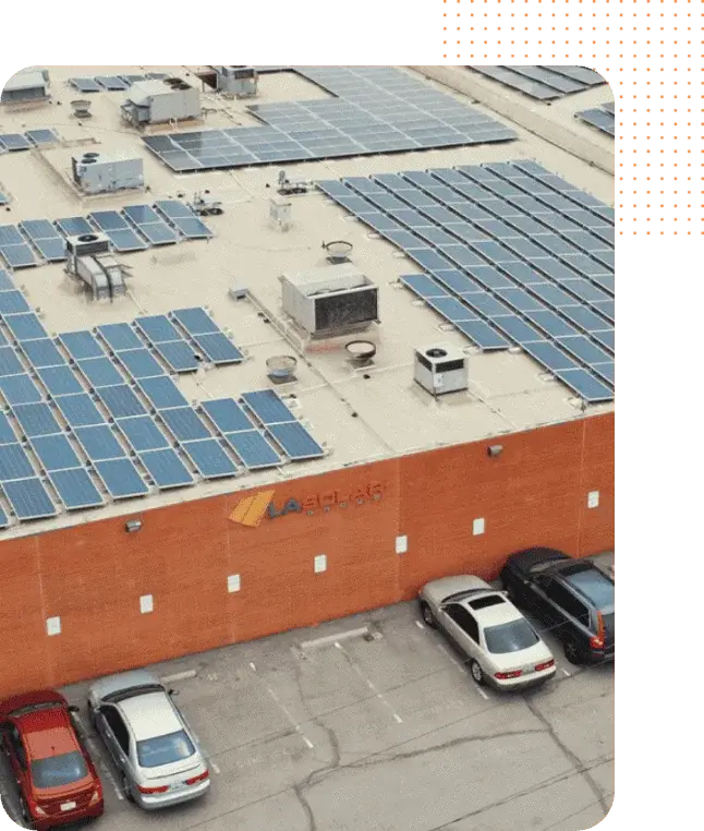 Solar panels on a commercial rooftop for renewable energy generation.