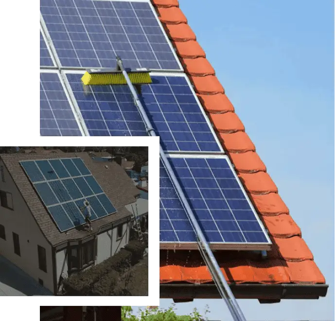 Solar panel roof cleaning process with a squeegee on blue solar panels.