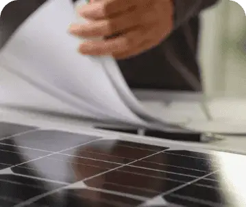Technician inspecting solar panels for maintenance and optimal performance.
